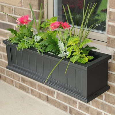 The Mayne Cape Cod 3ft Window Box, in the black finish, planted and mounted on home for curb appeal