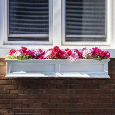 The Mayne Fairfield 5ft Window Box Planter, in the white finish, planted and mounted on home for curb appeal