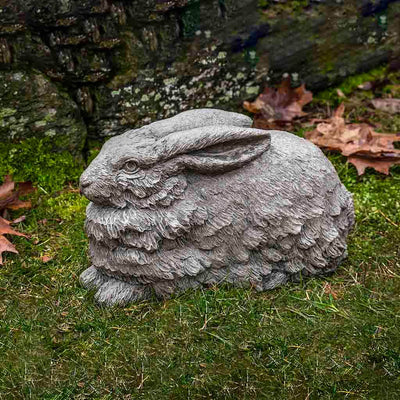Campania International Flemish Hare Statue, set in the garden to add charm and character. The statue is shown in the Greystone Patina.