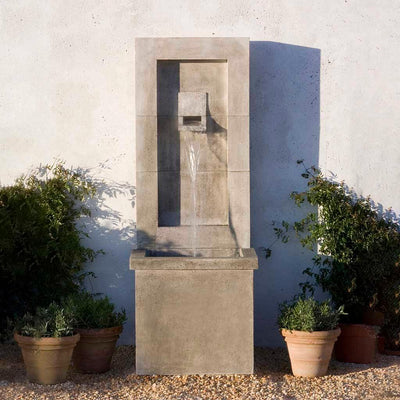 Campania International Moderne Fountain, adding interest to the garden with the sound of water. This fountain is shown in the Pietra Nuova Patina.