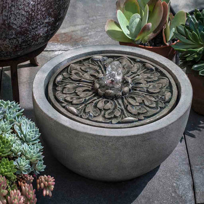 Campania International M-Series Medallion Fountain, adding interest to the garden with the sound of water. This fountain is shown in the Alpine Stone Patina.