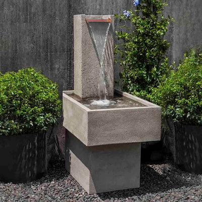 Campania International Falling Water Fountain III, adding interest to the garden with the sound of water. This fountain is shown in the Verde Patina.