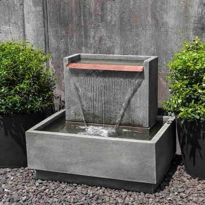 Campania International Falling Water Fountain II, adding interest to the garden with the sound of water. This fountain is shown in the Alpine Stone Patina.