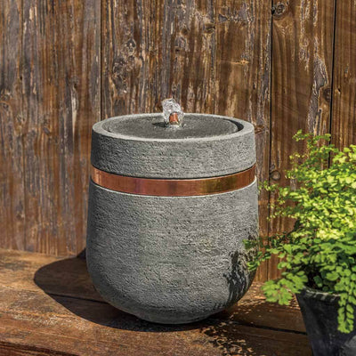 Campania International M-Series Parabola Fountain, adding interest to the garden with the sound of water. This fountain is shown in the Alpine Stone Patina.