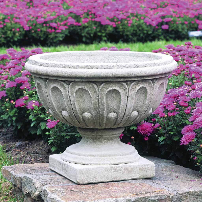 Campania International Longwood Fluted Urn is shown in the Verde Patina. Made from cast stone.