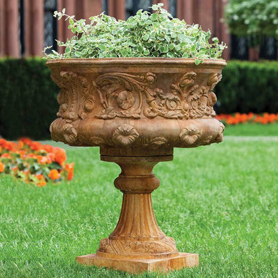 Campania International Smithsonian Morning Glory Urn is shown in the Ferro Rustico Nuovo Patina. Made from cast stone.