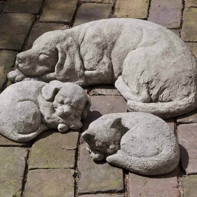Campania International Curled Dog Statue, naps are the best. The Curled Dog Statue is a sweet statue to add to a porch, patio or deck. Shown in the soft Greystone Patina.