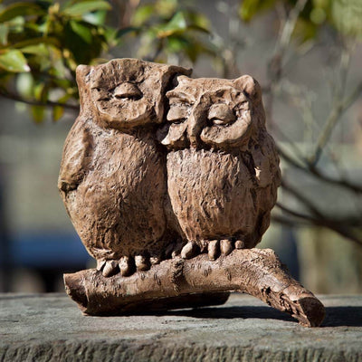 Campania International Honeymoon Owls Statue , set in the garden to add charm and character. The statue is shown in the Brownstone Patina.