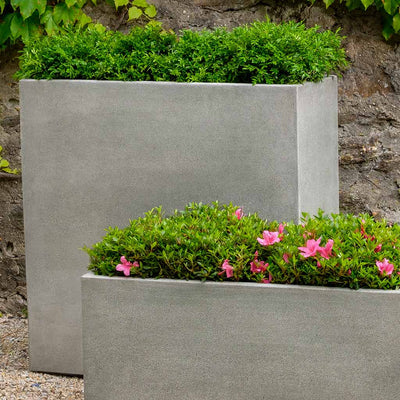 Campania International Metro Box Tall Planter has a modern look, perfect for patios and rooftops, shown in the Alpine Stone Patina. Made from cast stone.