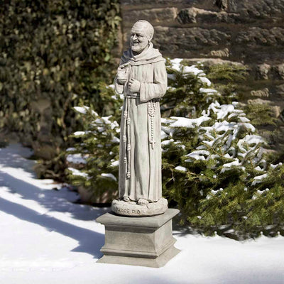 Campania International Padro Pio Statue placed in the garden. Religious garden statues, made of cast stone in a range of color options.
