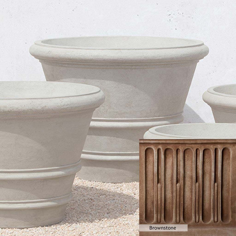 Brownstone Patina for the Campania International Classic Rolled Rim 35.5 inch Planter, brown blended with hints of red and yellow, works well in the garden.