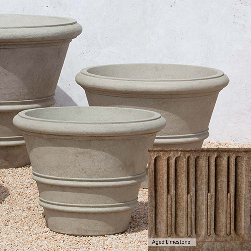 Aged Limestone Patina for the Campania International Classic Rolled Rim 27-inch Planter, brown, orange, and green for an old stone look.