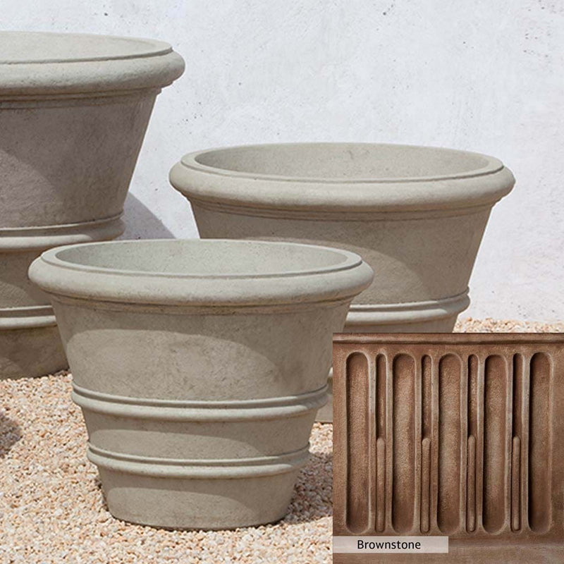 Brownstone Patina for the Campania International Classic Rolled Rim 27-inch Planter, brown blended with hints of red and yellow, works well in the garden.