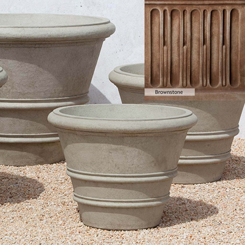 Brownstone Patina for the Campania International Classic Rolled Rim 24-inch Planter, brown blended with hints of red and yellow, works well in the garden.