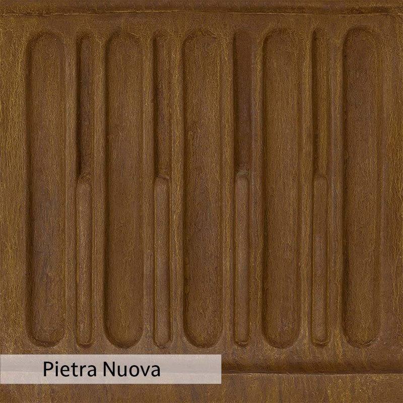 Pietra Nuova Patina stain on the Campania International Tall Cylinder Fountain, a rich brown blended with black and orange.