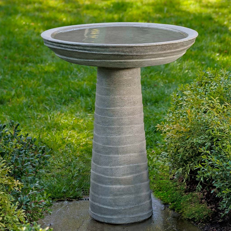 Campania International Ipanema Birdbath, shown in the Alpine Stone color, highlighting and enriching the details of the cast stone.