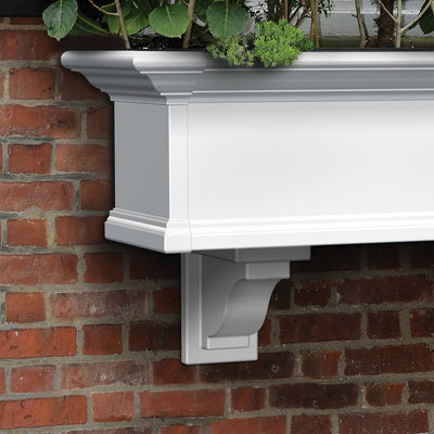 The Mayne Yorkshire Decorative Brackets, in the white finish, mounted under window box planter for curb appeal