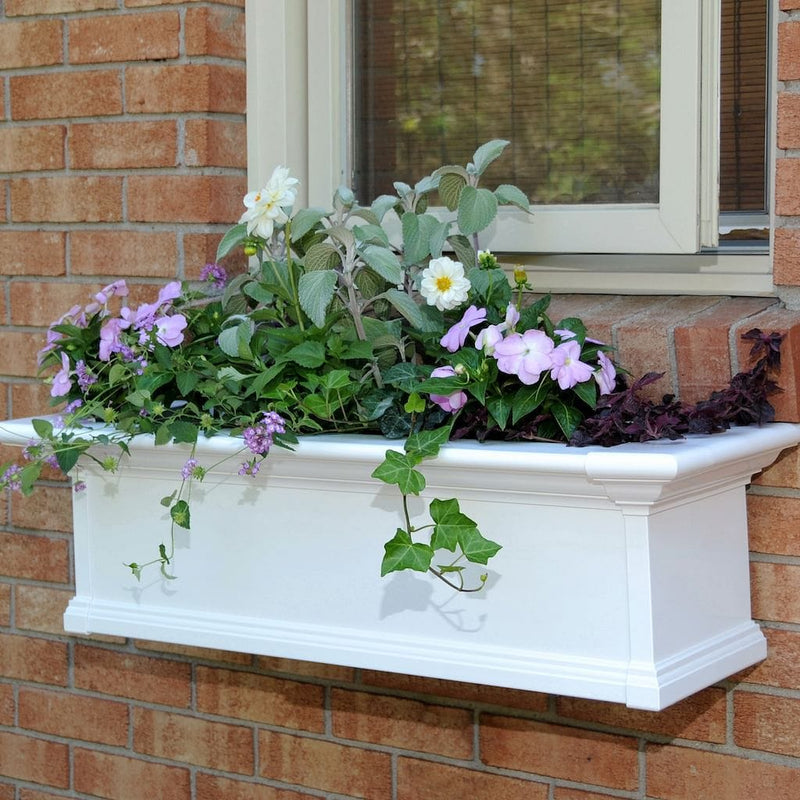 The Mayne Yorkshire 3ft Window Box, in the white finish, planted and mounted on home for curb appeal