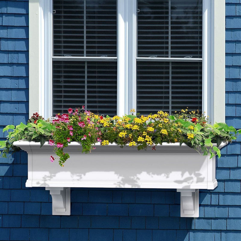 The Mayne Yorkshire 4ft Window Box, in the white finish, planted and mounted on home for curb appeal