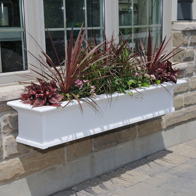 The Mayne Yorkshire 5ft Window Box, in the white finish, planted and mounted on home for curb appeal