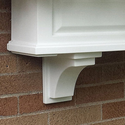 The Mayne Nantucket Decorative Brackets 2 pack, in the white finish, mounted under window box planter for curb appeal