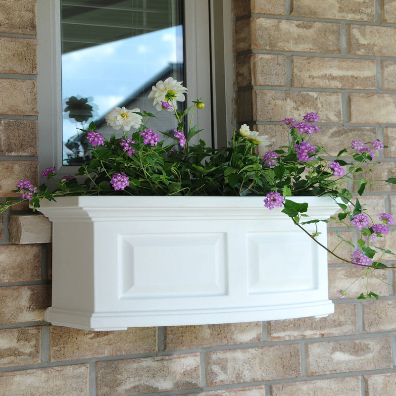 The Mayne Nantucket 2ft Window Box Planter, in the white finish, planted and mounted on home for curb appeal