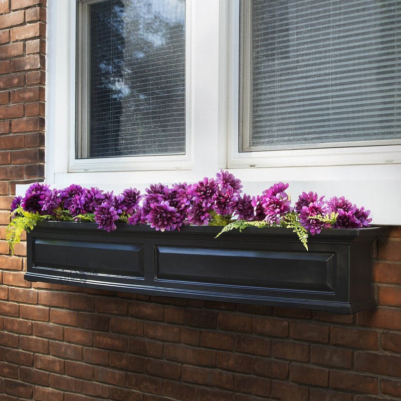The Mayne Nantucket 5ft Window Box, in the black finish, planted and mounted on home for curb appeal