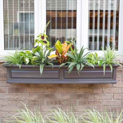 The Mayne Nantucket 5ft Window Box, in the graphite finish,planted and mounted on home for curb appeal