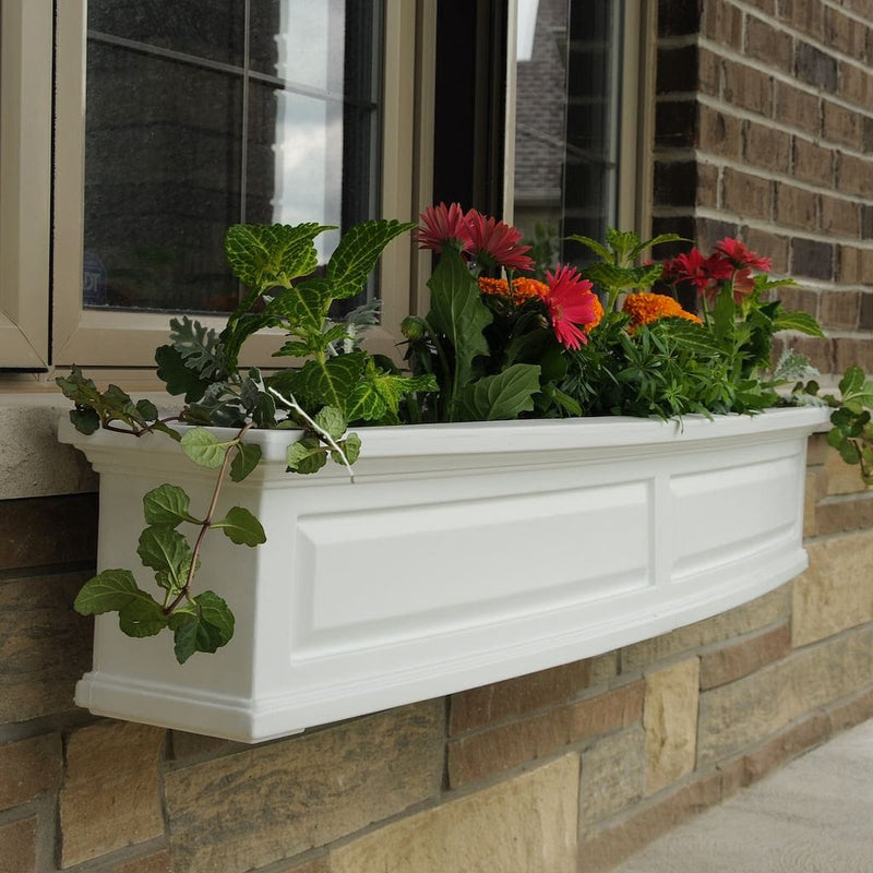 The Mayne Nantucket 5ft Window Box, in the white finish, planted and mounted on home for curb appeal