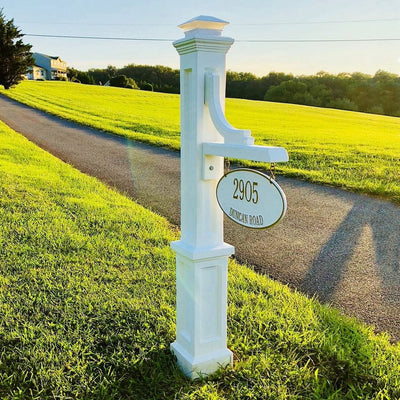 The Mayne Woodhaven Address Sign Post, in the white finish, installed for curb appeal.