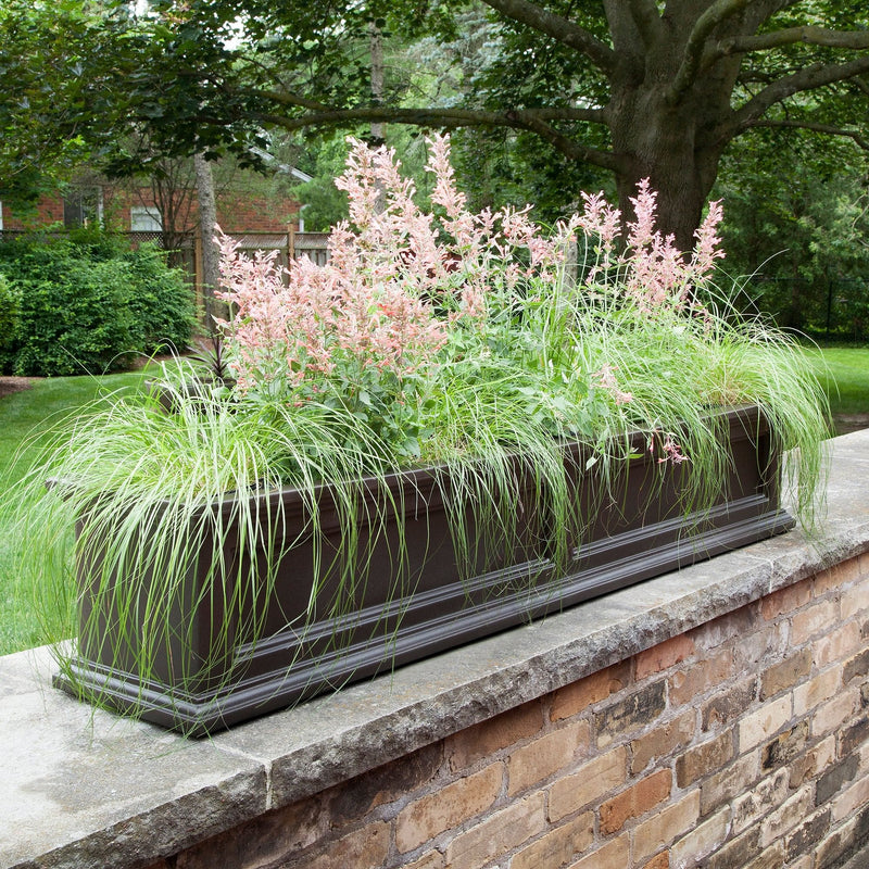 The Mayne Fairfield 5ft Window Box Planter, in the espresso finish, planted and mounted on home for curb appeal