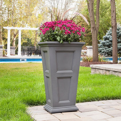 The Mayne Fairfield Tall Planter, in the graphite finish,planted and placed near home for curb appeal.
