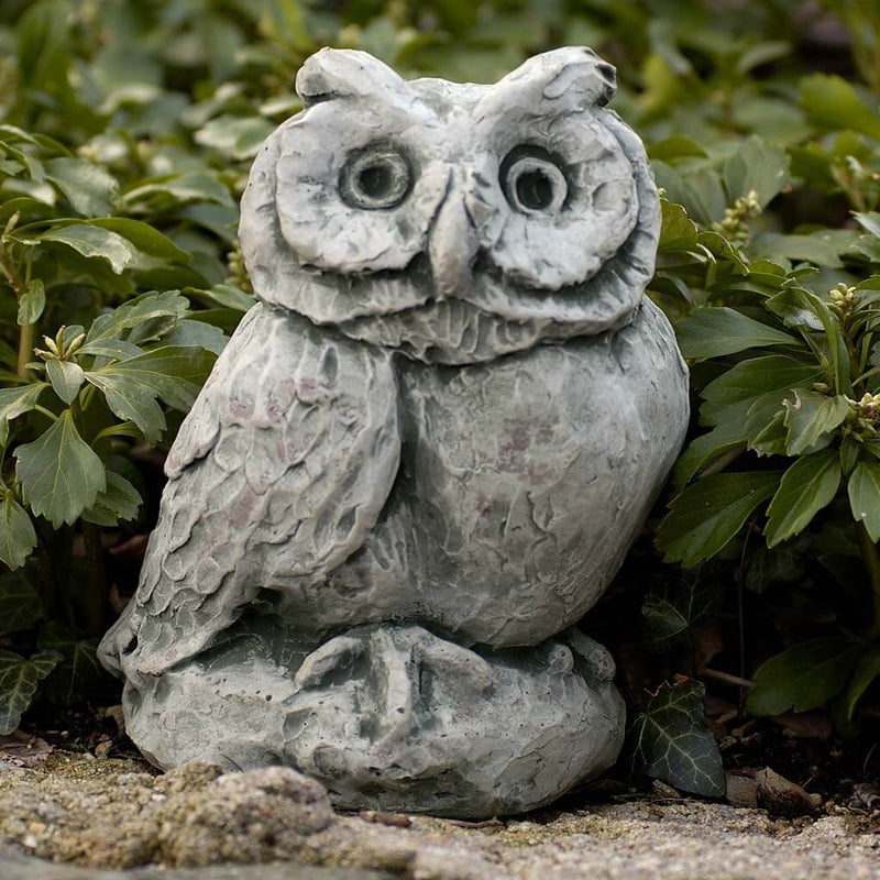 Campania International Merrie Little Owl Statue, set in the garden to add charm and character. The statue is shown in the Alpine Stone Patina.