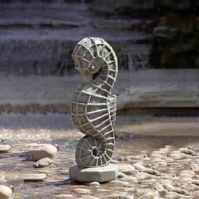 Campania International Seahorse Statue, set in the garden to add charm and character. The statue is shown in the Greystone Patina.