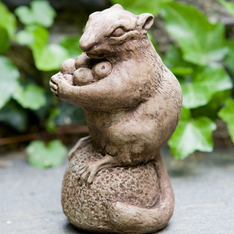 Campania International Autumn Chipmunk Statue, set in the garden to add charm and character. The statue is shown in the Brownstone Patina.