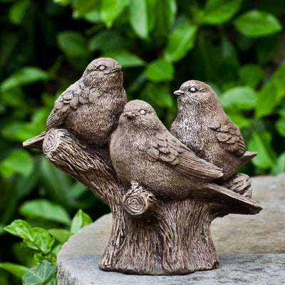 Campania International Three's Company Statue, set in the garden to add charm and character. The statue is shown in the Brownstone Patina.