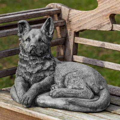 Campania International Shepherd Pup Statue stained in the Alpine Stone  patina, the ideal color for this garden statue.