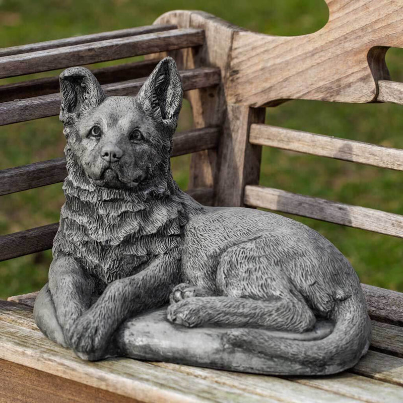 Campania International Shepherd Pup Statue stained in the Alpine Stone  patina, the ideal color for this garden statue.