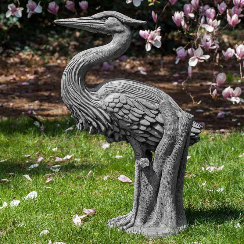 Campania International Heron Statue, set in the garden to add charm and character. The statue is shown in the Alpine Stone Patina.