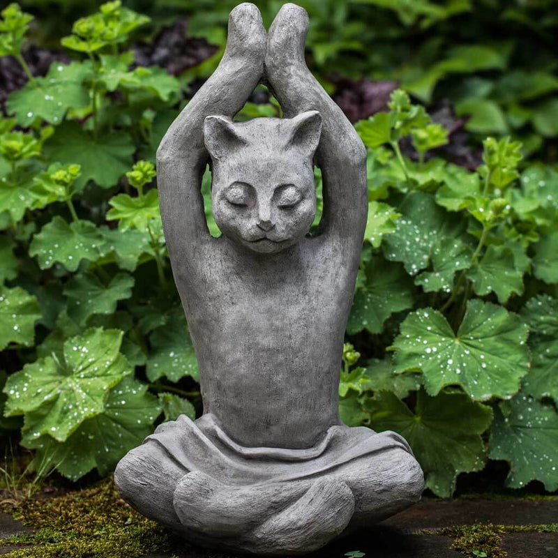 Campania International Yoga Cat Statue, set in the garden to add charm and character. The statue is shown in the Alpine Stone Patina.