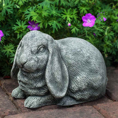 Campania International Lop-Eared Bunny Statue stained in the Alpine Stone  patina, the ideal color for this garden statue.