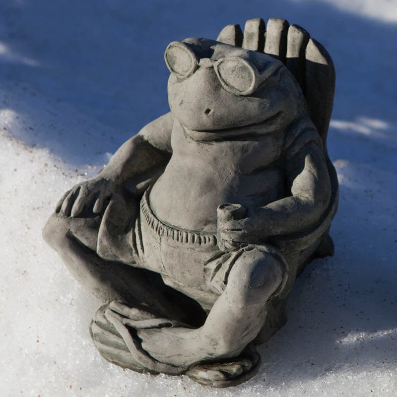 Campania International Bud on the Beach Statue, set in the garden to add charm and character. The statue is shown in the Alpine Stone Patina.