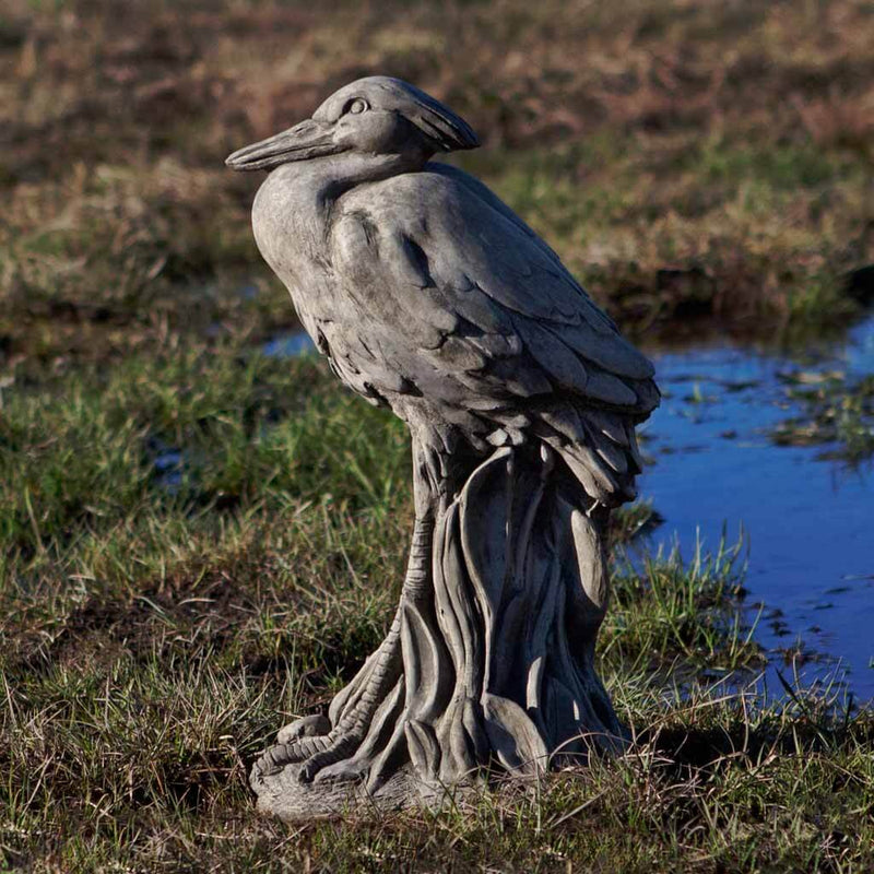 Campania International Egret Statue, set in the garden to add charm and character. The statue is shown in the Greystone Patina.
