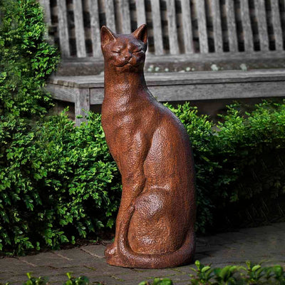 Campania International Checkers Statue, set in the garden to add charm and character. The statue is shown in the Ferro Rustico Nuovo Patina.