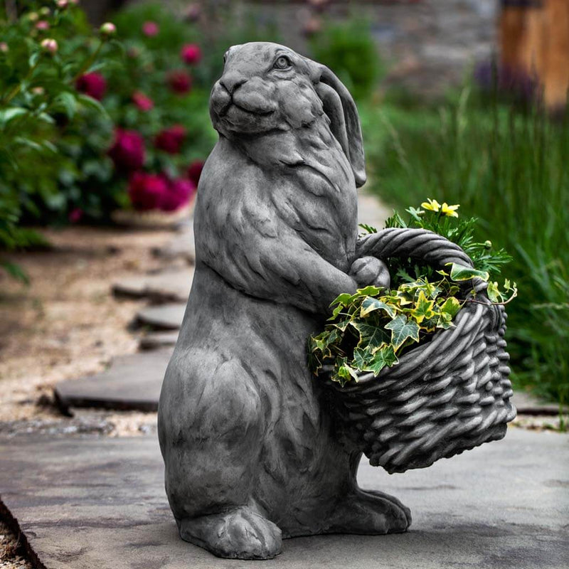 Campania International Spring Hare Statue, set in the garden to add charm and character. The statue is shown in the Alpine Stone Patina.