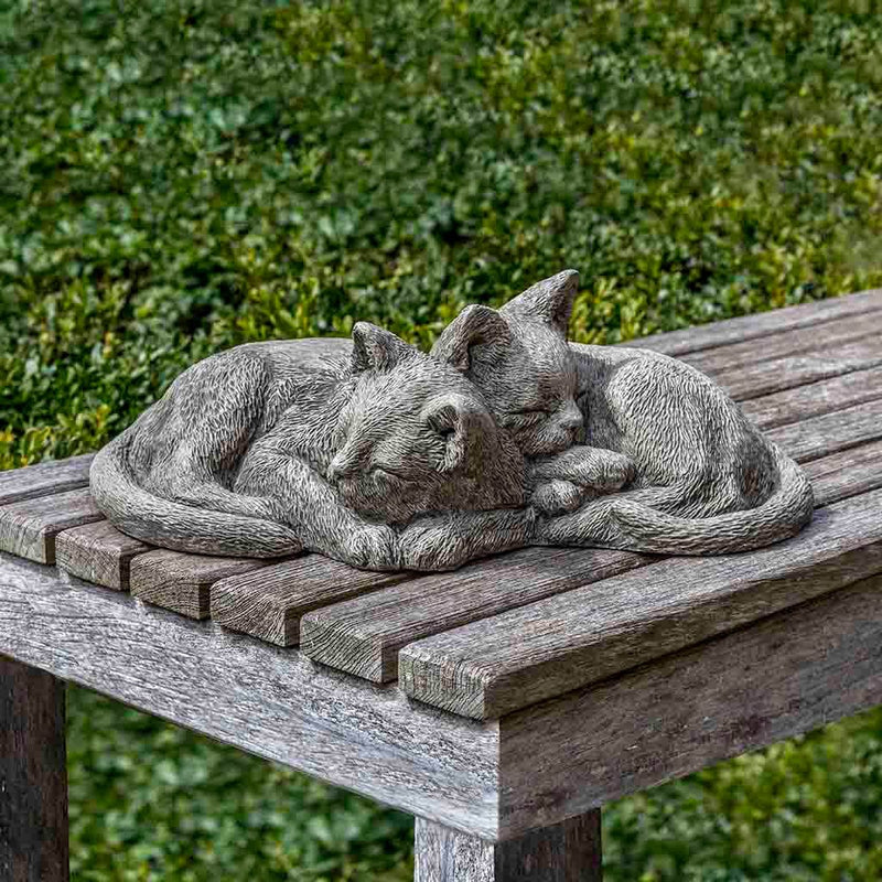 Campania International Nap Time Kittens Statue, set in the garden to add charm and character. The statue is shown in the Alpine Stone Patina.