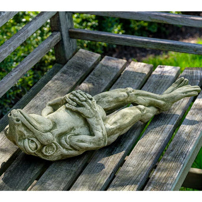 Campania International Cloud Gazing Statue, set in the garden to add charm and character. The statue is shown in the English Moss Patina.