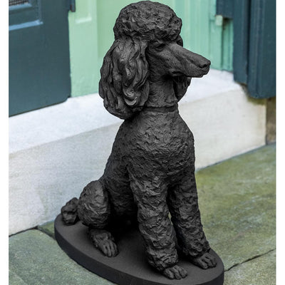 Campania International Maurice Dog Statue is ready to greet the guests. Shown in Nero Nuovo Patina