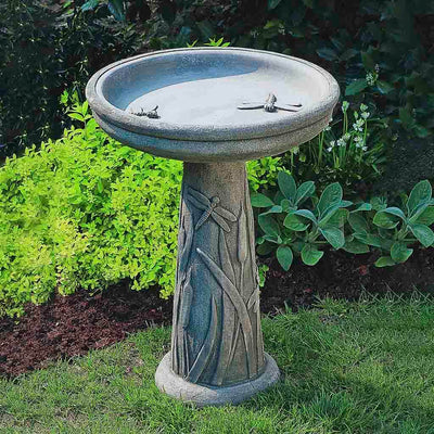 Campania International Dragonfly Birdbath, displayed in Greystone, a classic garden gray and a best-selling color.