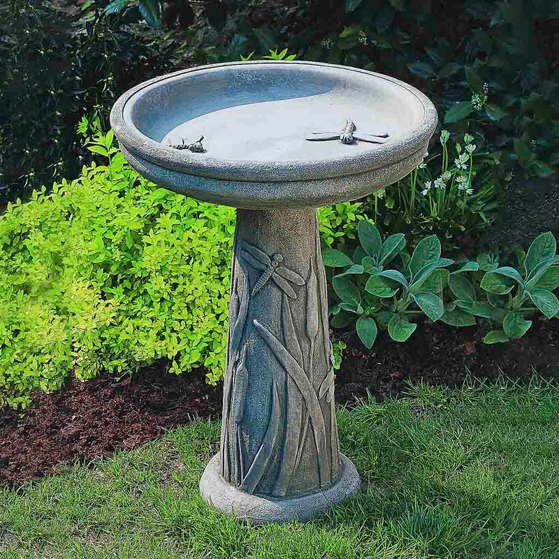 Campania International Dragonfly Birdbath, displayed in Greystone, a classic garden gray and a best-selling color.
